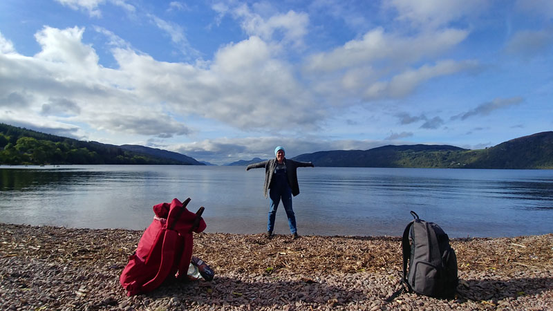 Photo of Abby Thatcher in front of a Scottish loch while on her life-changing study abroad.